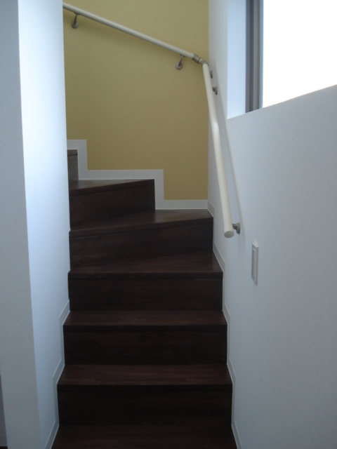 Other room space. Color contrast oo of yellow walls and stairs