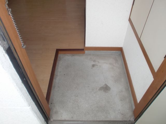 Entrance. It is a simple kitchen. 