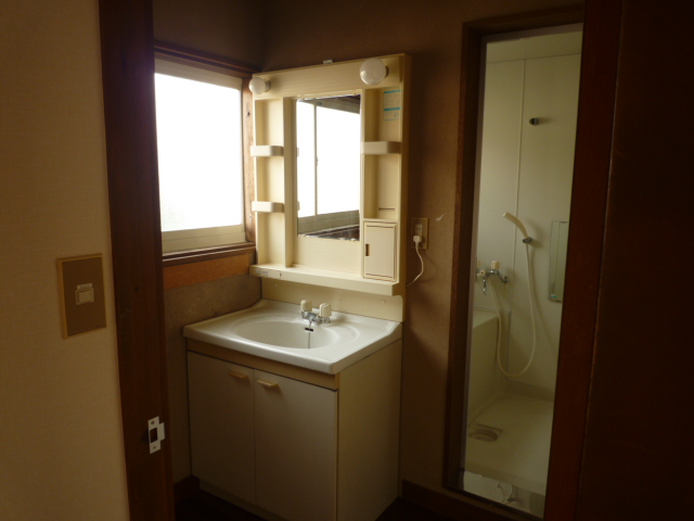 Washroom. There is a sliding door. 