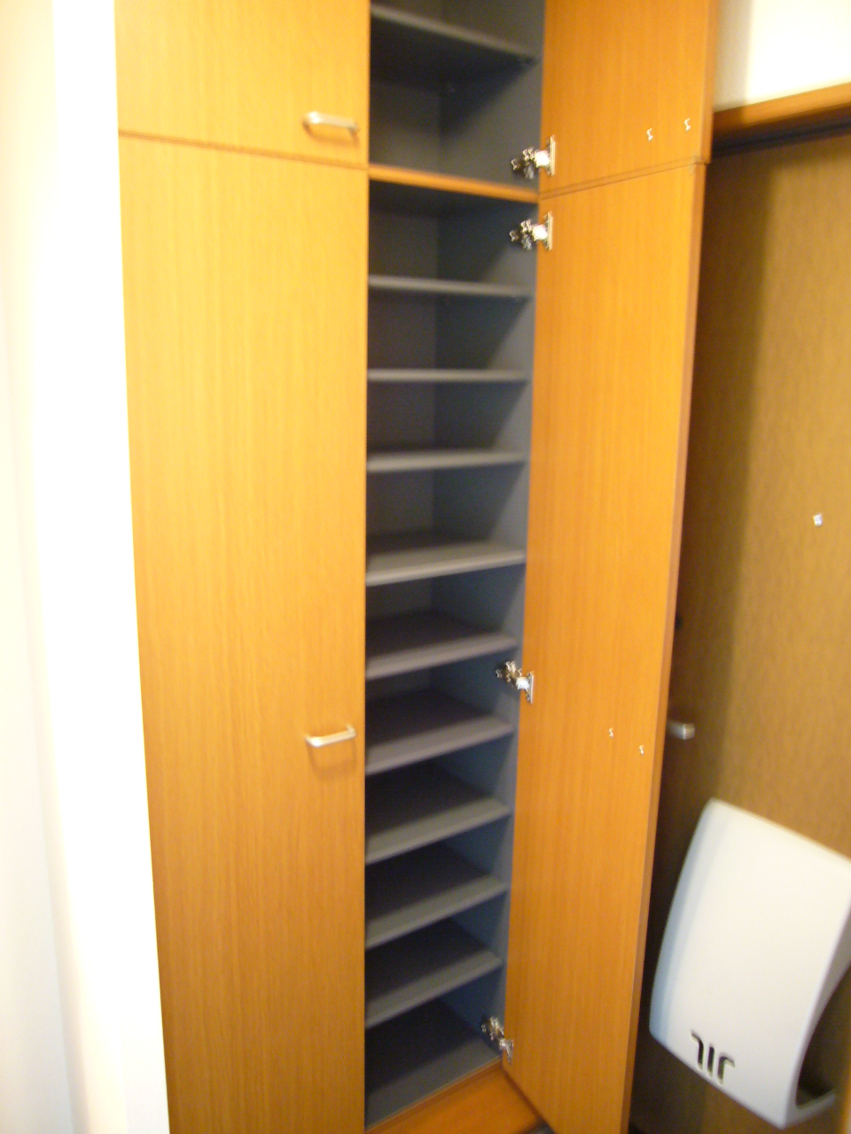 Entrance. Wide entrance storage of up to ceiling