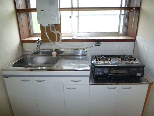 Kitchen. Was established stove new. 