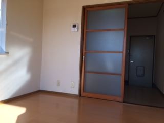 Living and room. It is a cross which was the white tones.