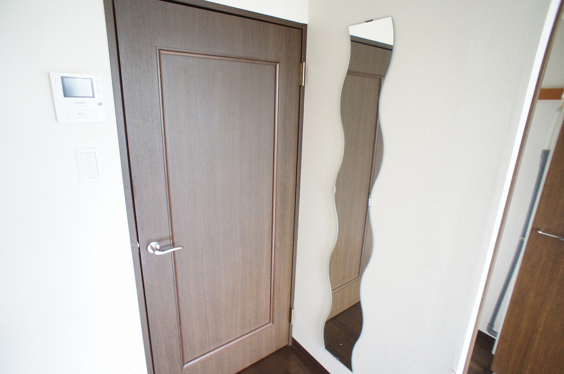 Living and room. This stylish, full-length mirror.