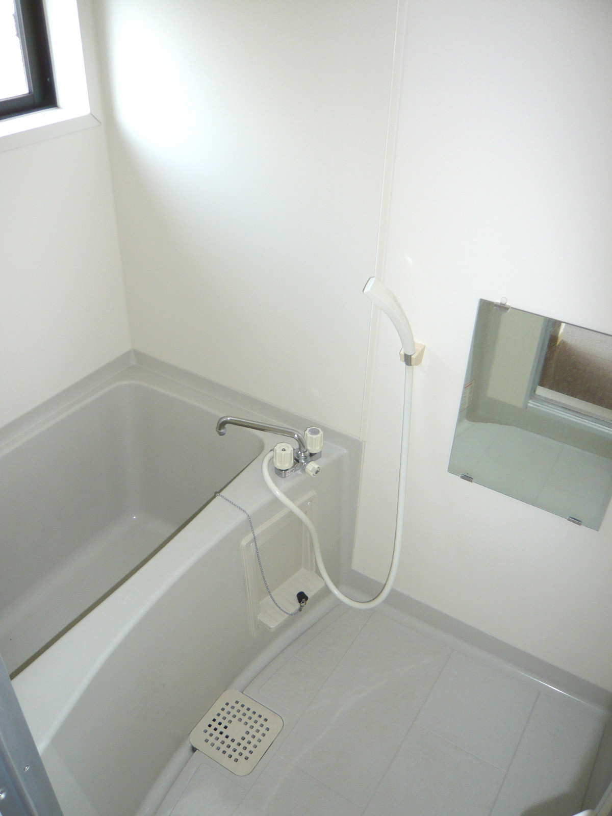 Bath. It is a window with a bathroom