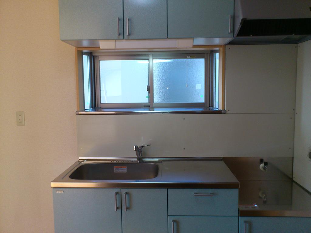 Kitchen. There is also the upper and lower housing. It is also glad there is a window in the kitchen. 