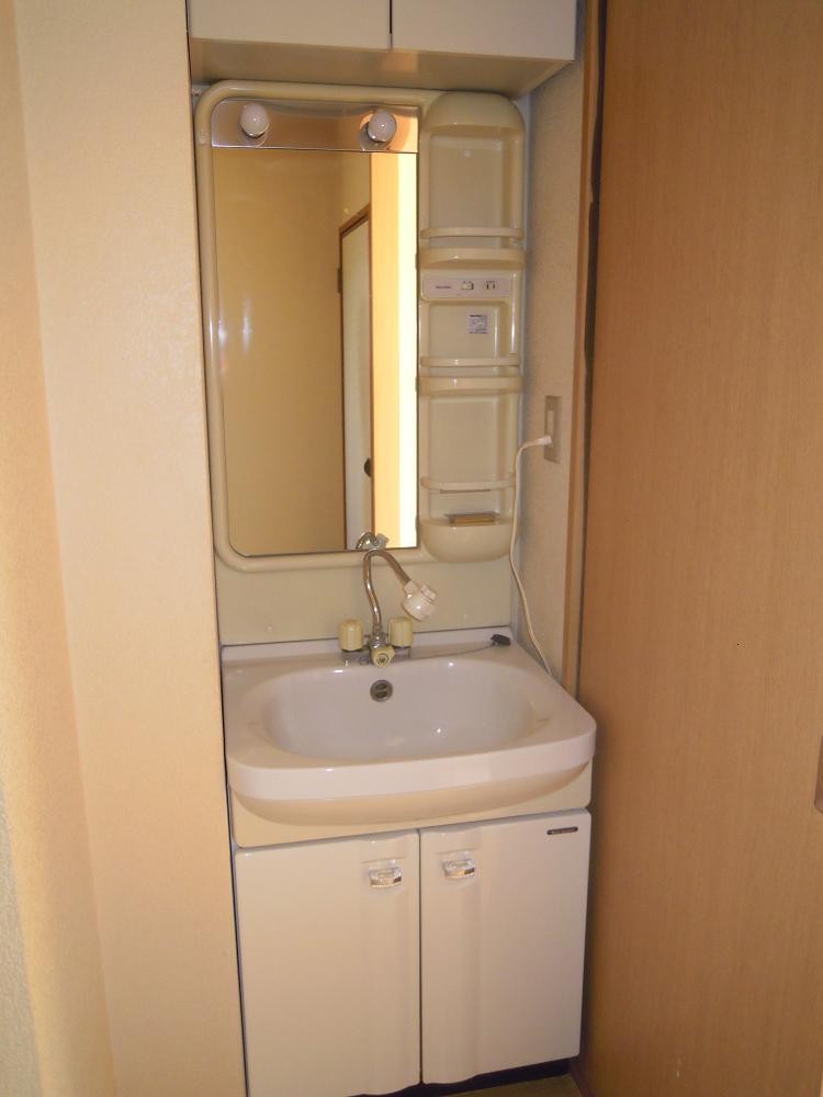 Washroom. Wash basin is useful in a busy morning with a shower