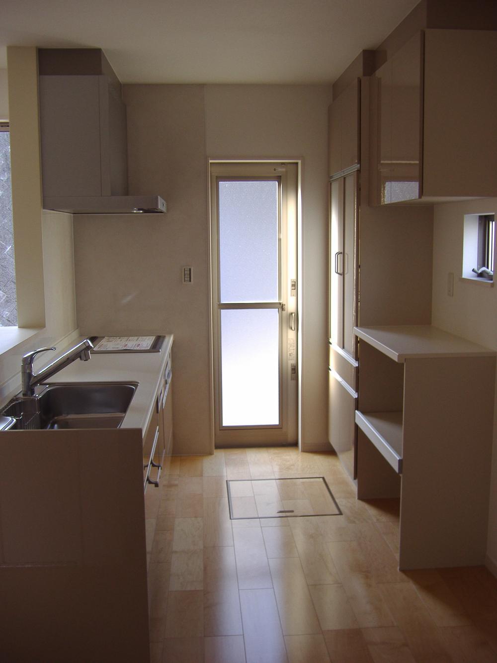 Kitchen. There is a back door, Cupboard in the back (November 2013) Shooting