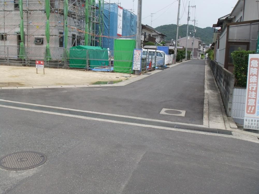 Local photos, including front road. Land and surrounding from west