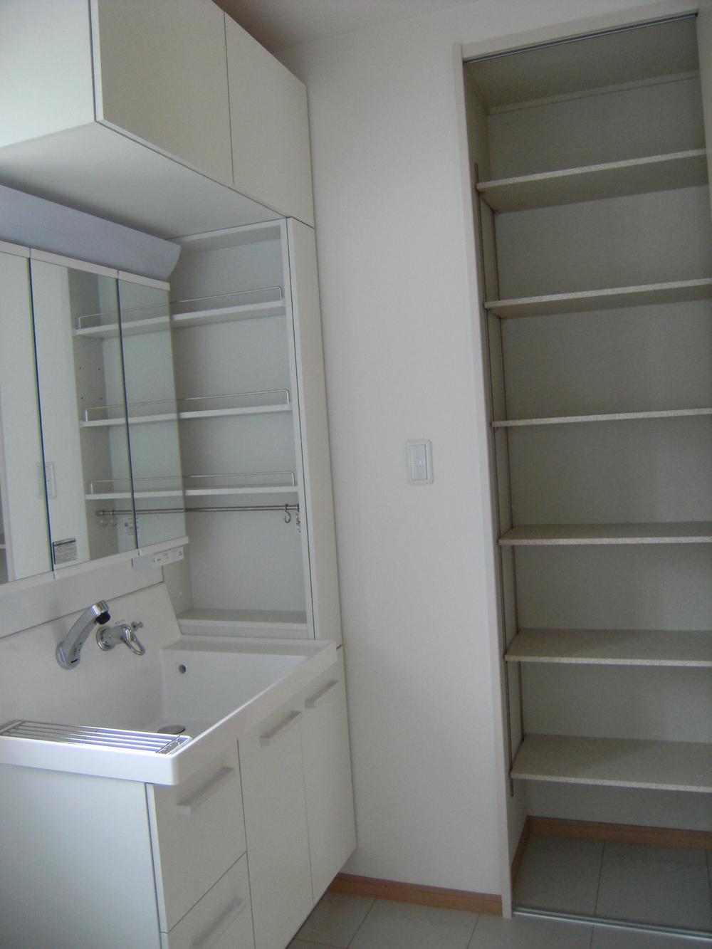 Wash basin, toilet. Also it comes with a lot of storage shelves to wash undressing room.