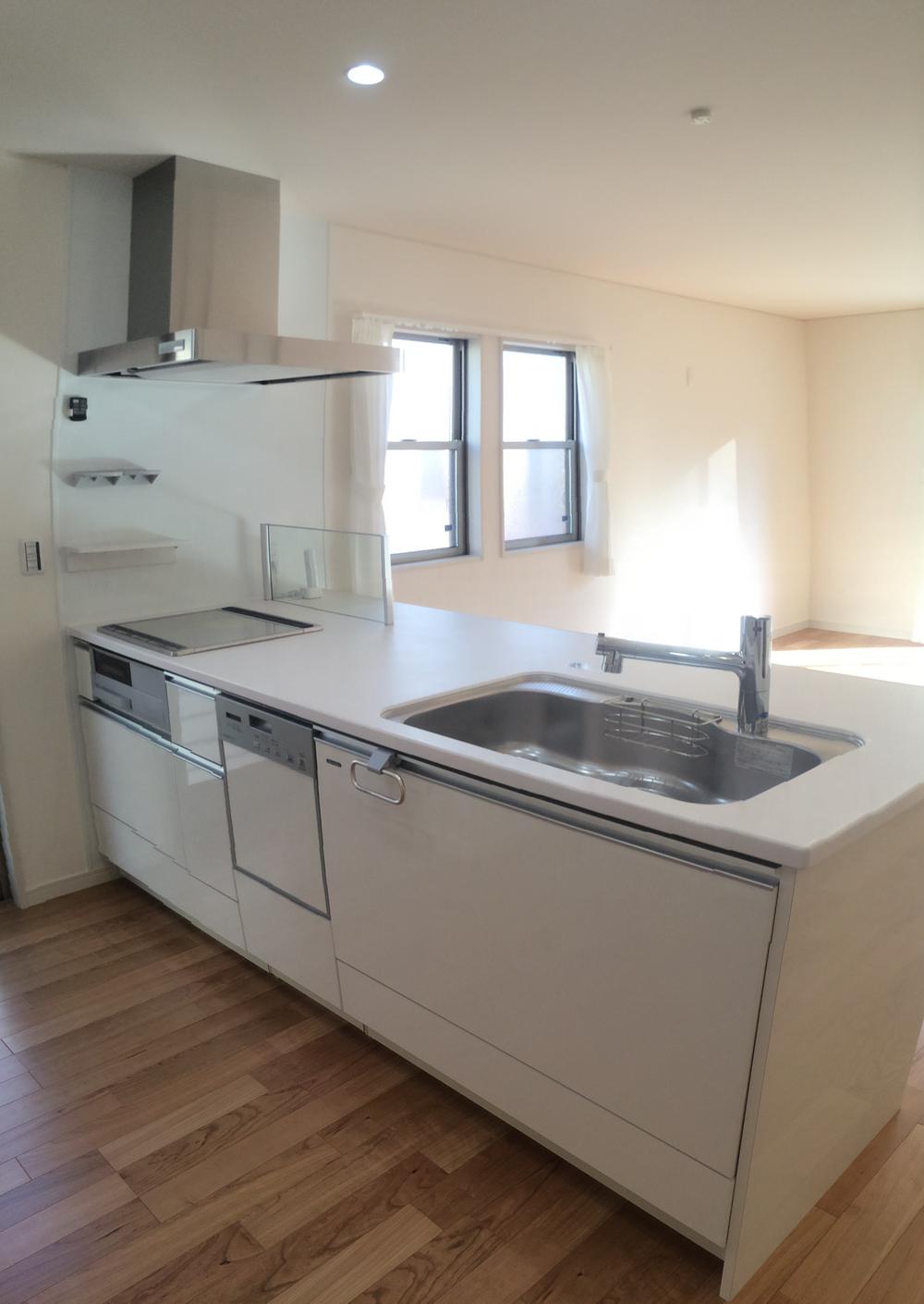 Kitchen. Bright and airy full open kitchen. We put a lot of dishes in a flat counter. 