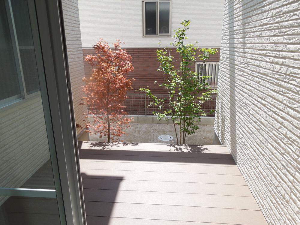 Garden. Wood deck as seen from the living room