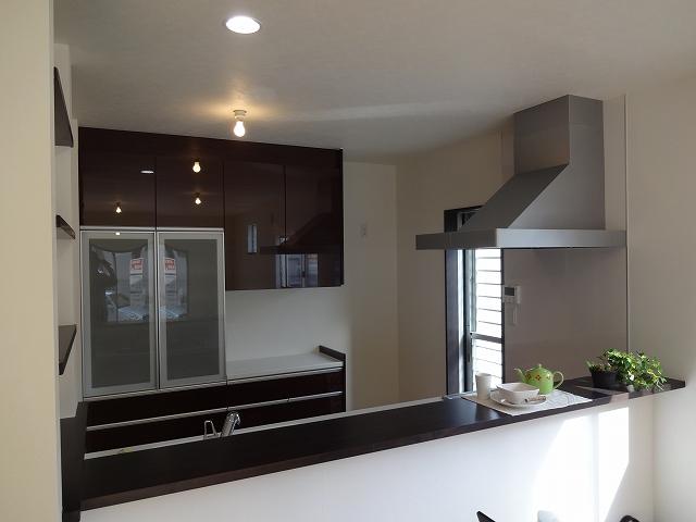 Kitchen. System is with a cupboard of the kitchen and similar colors