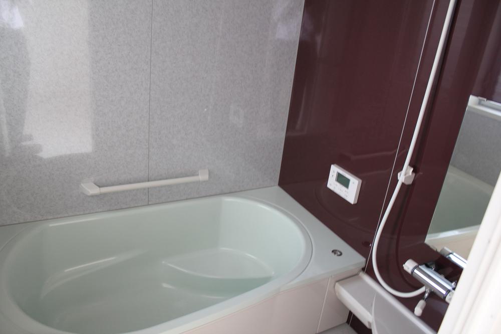 Bathroom. Comfortable tub.  It has a window. 