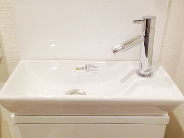 Toilet.  [Hand wash basin] Installing a hand wash basin, which was secured at the bottom storage space.