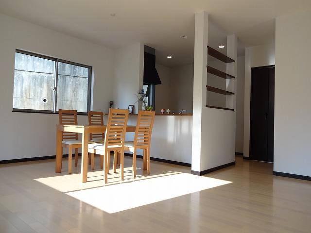 Living. Sunny spacious living Stylish counter kitchen