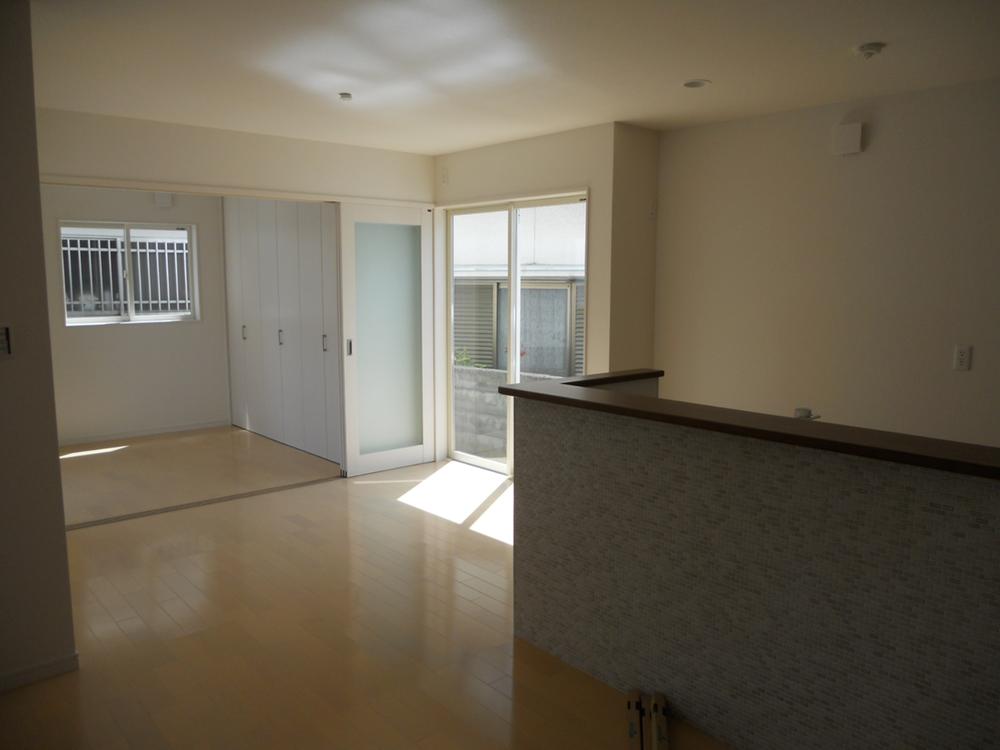 Living. Outside of the kitchen is tiled