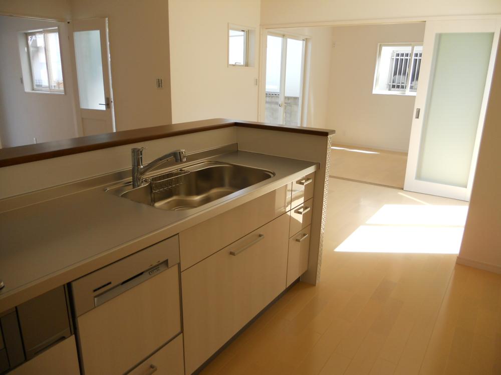 Living. It is living from the kitchen