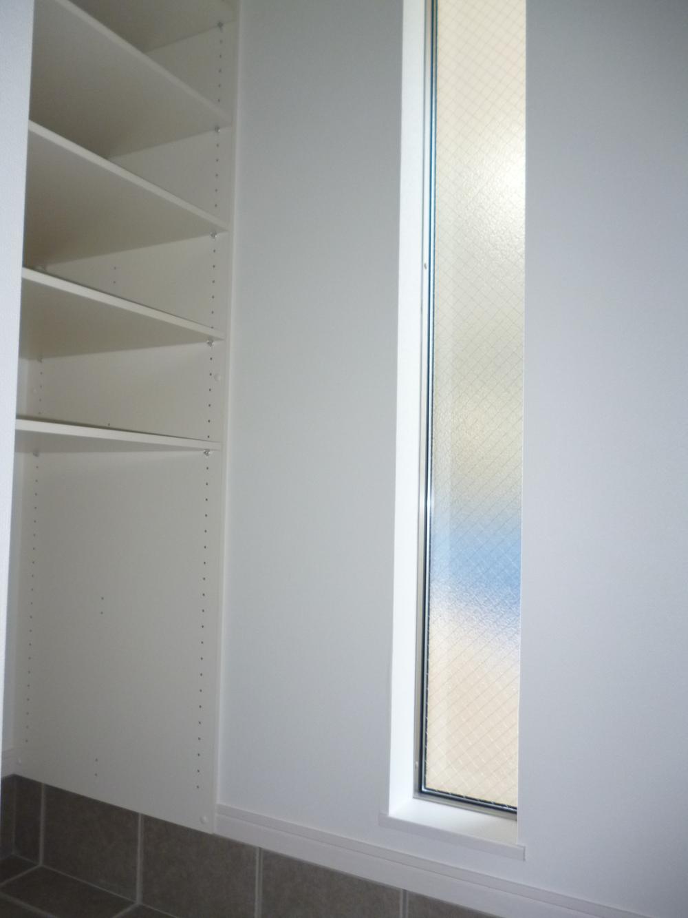 Other. Entrance next to the storage is also bright because there is lighting up.