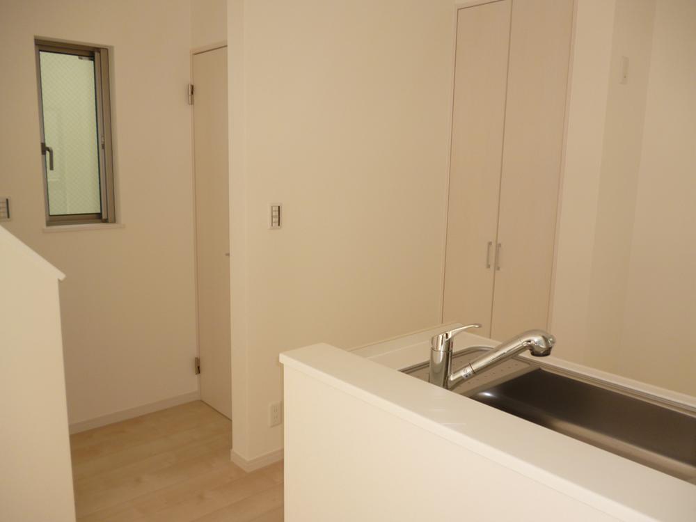 Other. Stairs from the kitchen next to, The back of the door is the toilet, Near side storage.