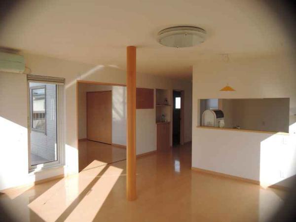 Living. Large second floor living room with a face-to-face kitchen