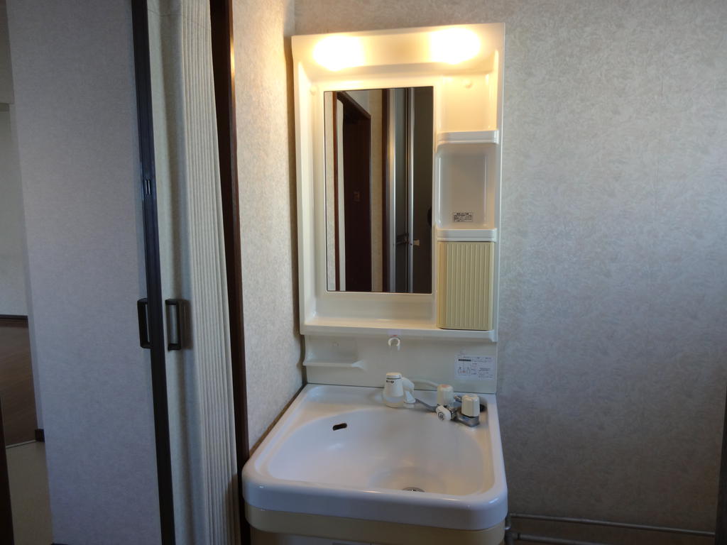 Washroom. Convenient because space is often put things! 