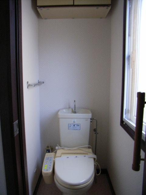 Toilet. There are large windows