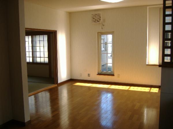 Living. There is a big bay window on the corner