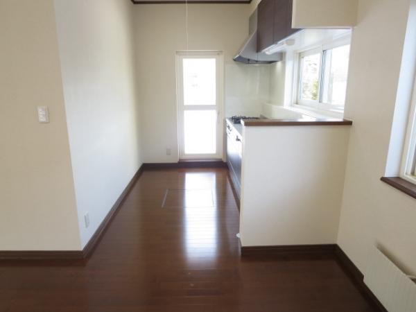 Kitchen. The kitchen next to, There is space to put a table. Also it comes with a heater in the kitchen next to. There is also a back door. 