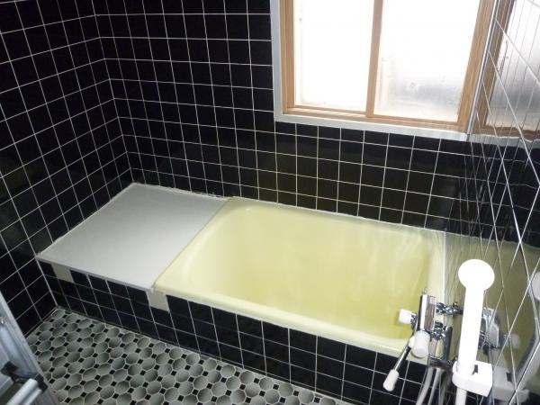 Bathroom. It is a bath with a window.