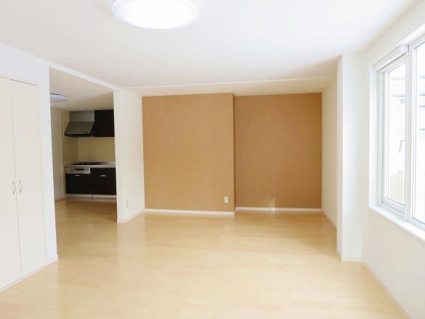 Living. Living room wall is diatomaceous earth. A partially cross was finished on re-covering.