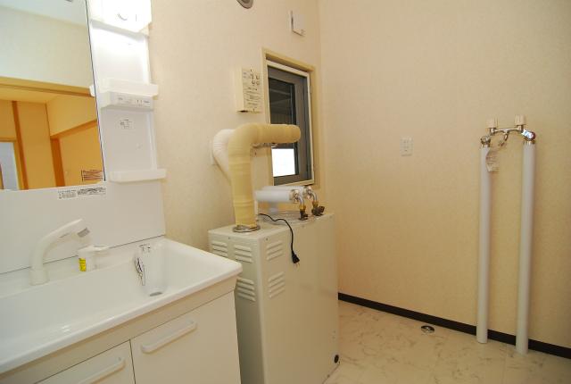 Wash basin, toilet. There are washing machine space