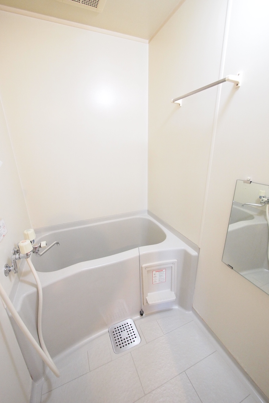 Bath. Water is around. 