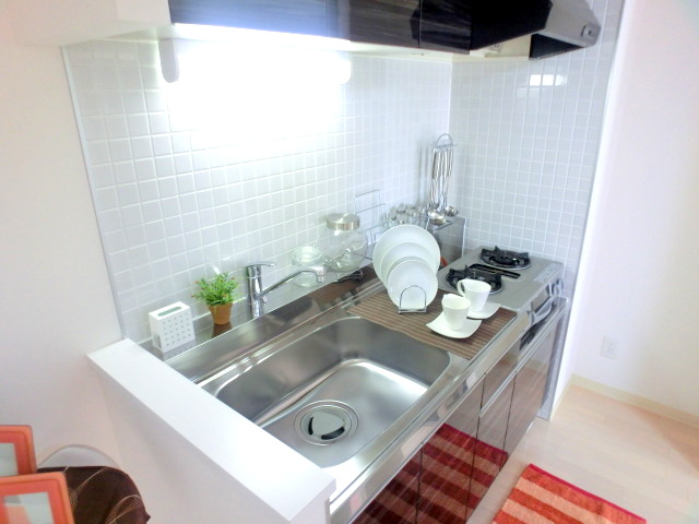 Kitchen. It is a photograph of another in Room for in occupancy. 