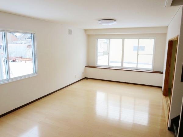 Living. Bright living room with large bay windows of the south-west-facing