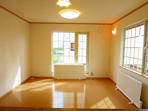 Living. Bright living room there is a window on the east side and the west side