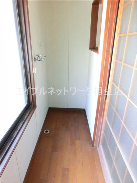 Other room space. Washing machine in the room