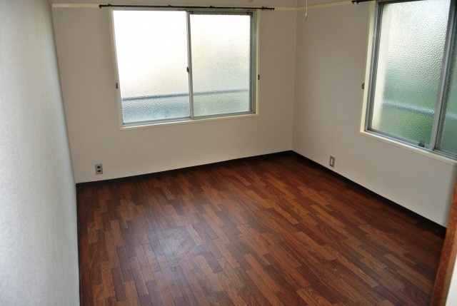 Living and room. Large windows are two in bright
