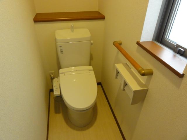 Toilet. INAX made warm water washing toilet seat