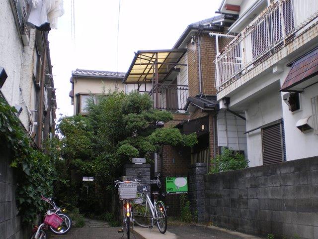 Local appearance photo. Of ordinary car one car garage and garden