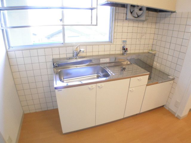 Kitchen. It is a bright kitchen with a window