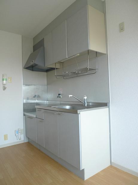 Kitchen. A separate room is a reference photograph