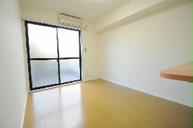 Living and room. It is day preeminent in the large windows.