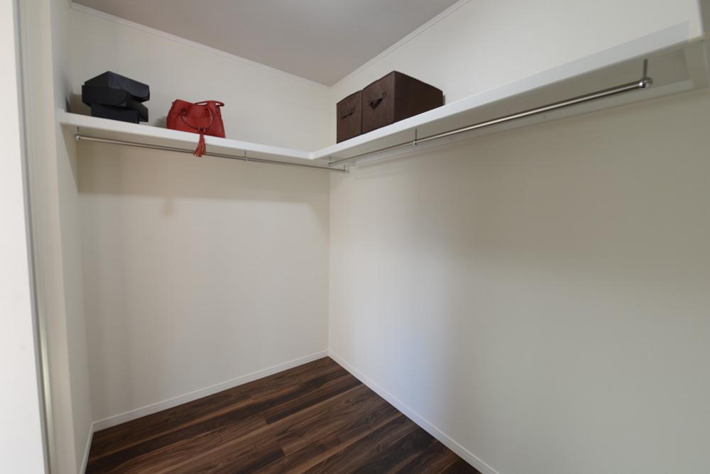 Model house photo. It features a the master bedroom walk-in closet that can be plenty of storage.