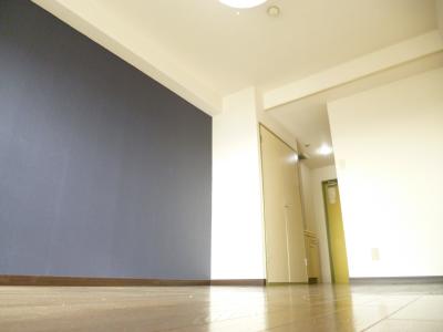 Other room space. I wallpaper is accented.