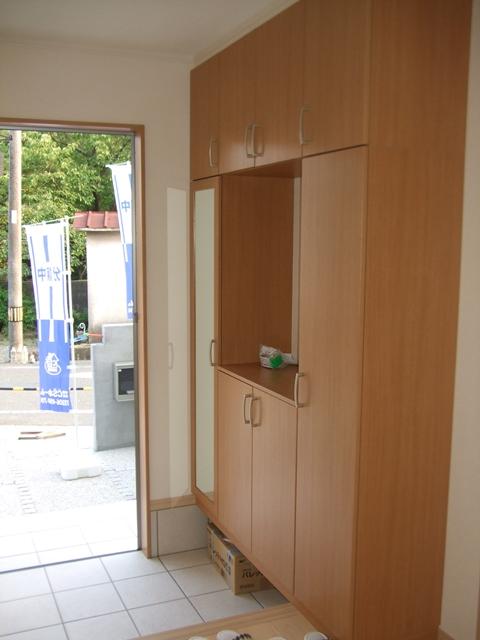 Entrance. There is also a cupboard and front door storage of large capacity.