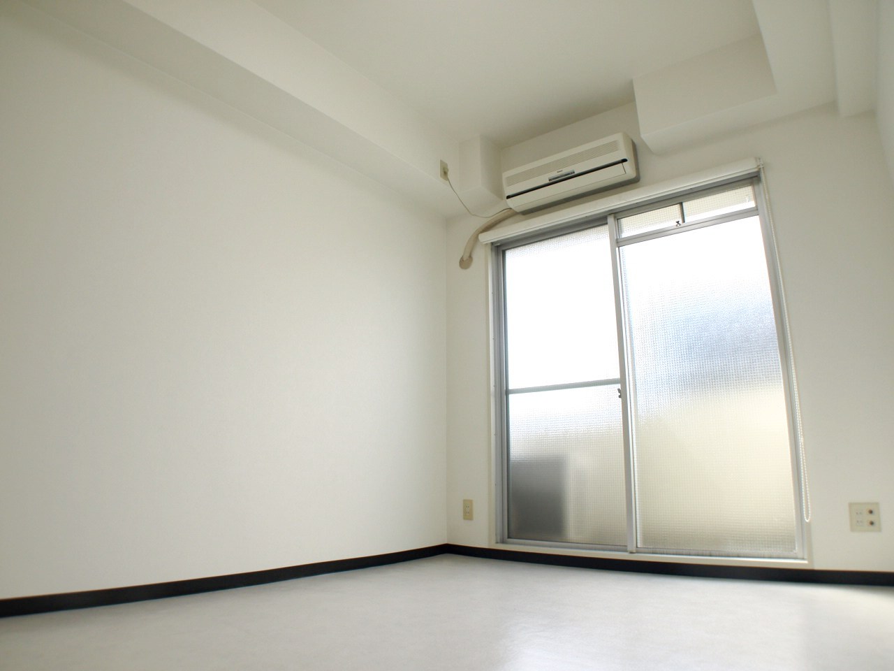 Living and room. It is a white living room