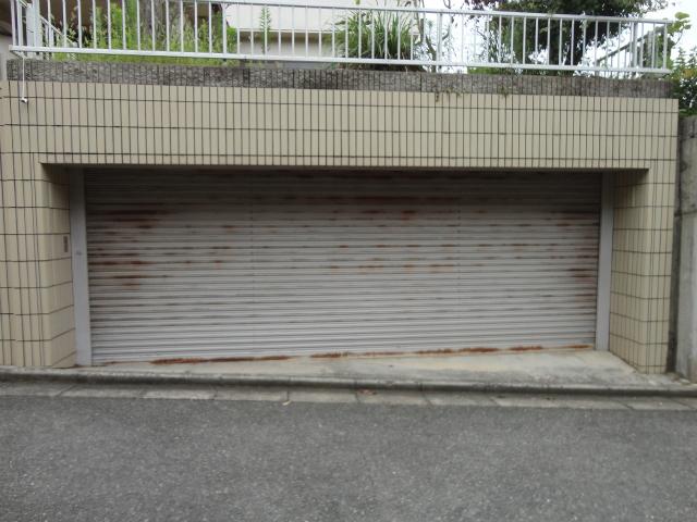 Parking lot. Shuttered excavation garage