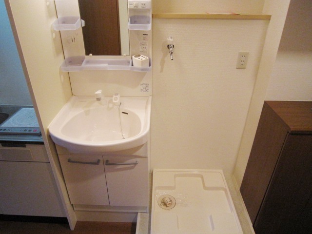 Washroom. Washbasin glad shower in the morning