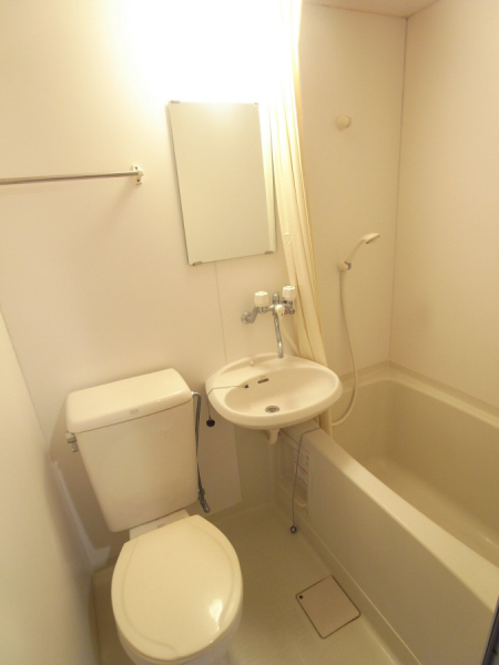 Toilet. It is decorated in 208 in Room.