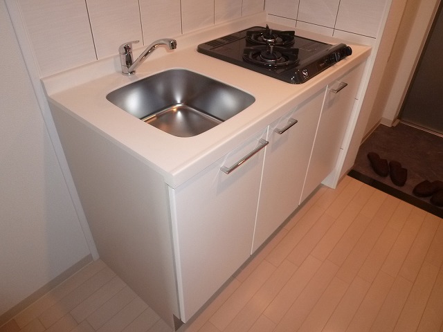 Kitchen. Pat is also cooking at 2 lot gas stoves